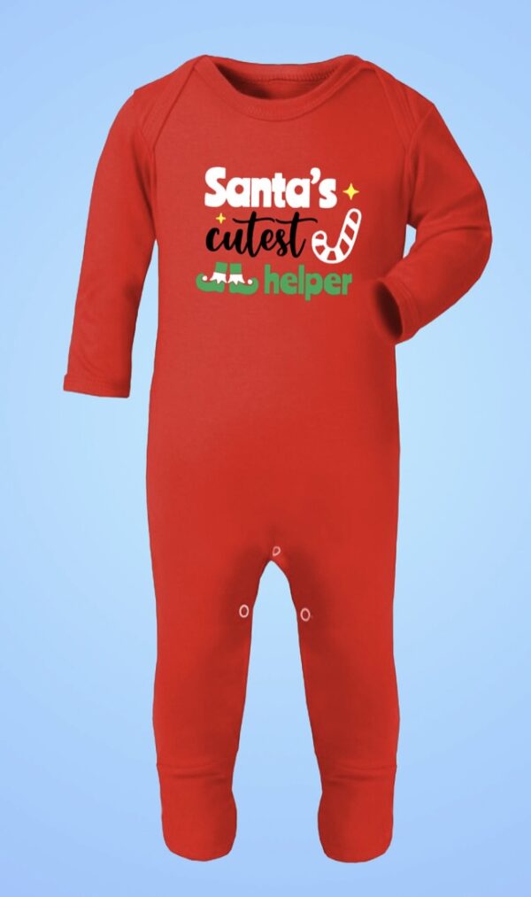 red Christmas sleepsuit with Santa’s cutest helper print